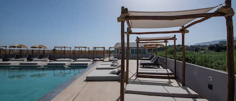 Seasonal outdoor pool, pool umbrellas, sun loungers