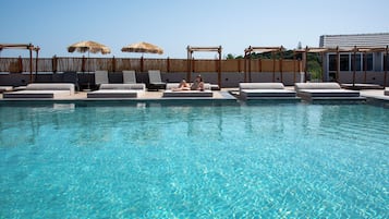 Seasonal outdoor pool, pool umbrellas, pool loungers