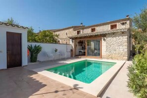 Enjoy a pool area with a patio, perfect for relaxation.