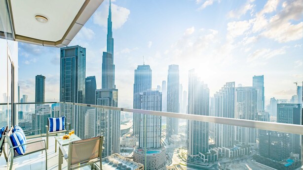 A high-rise balcony with a city view, including the Burj Khalifa. - LUX Paramount Burj View Business Bay (Dubai)