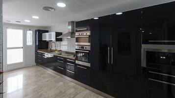 Coffee/tea maker, fridge, microwave, oven