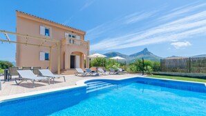 A swimming pool with lounge chairs and a building with a balcony. - Dones D'aigua 11 - Villa With Private Pool (S'estanyol (colònia De Sant Pere), Illes Balears)