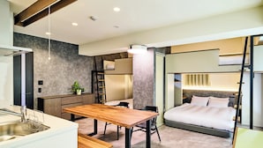 A compact hotel room with a bed, a small kitchenette, a dining area, and a bathroom. - HOTEL ALL IN TOKYO ASAKUSABASHI (Tokyo)