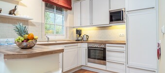 Villa Kormoran for 8 people with its own beach chair directly behind the dune