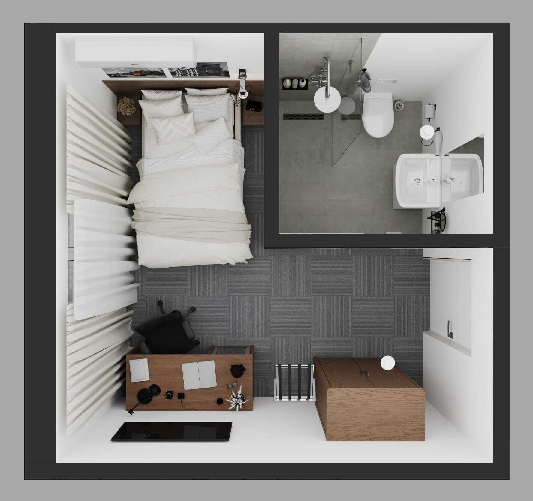 A compact bedroom with a bed, bedside table, and a small desk area.