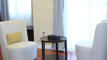 Deluxe Double Room, Balcony | Living area | 43-inch Smart TV with satellite channels, streaming services
