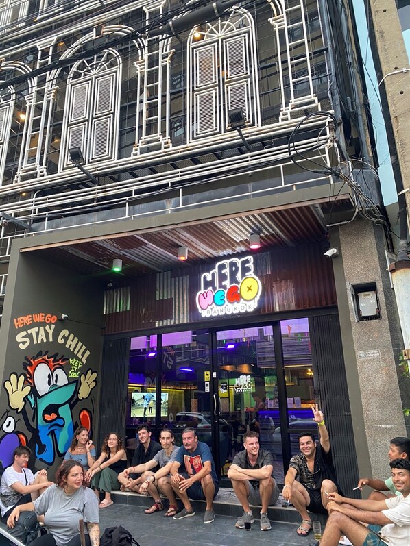 A building with a sign reading "Here We Go Bangkok" and a mural with a cartoon character. - Here We Go Bangkok (Bangkok)