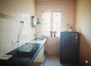 Classic Apartment, 1 King Bed, Balcony, Pool View | Private kitchen | Stovetop, electric kettle, cookware/dishes/utensils, cleaning supplies