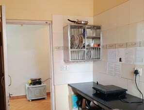 Classic Apartment, 1 King Bed, Balcony, Pool View | Private kitchen | Stovetop, electric kettle, cookware/dishes/utensils, cleaning supplies