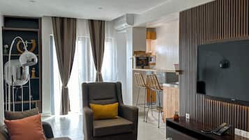 Luxury Penthouse, City View | Living area | 45-inch Smart TV with cable channels