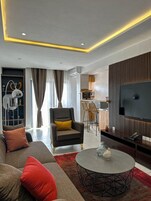 Luxury Penthouse, City View | Living area | 45-inch Smart TV with cable channels