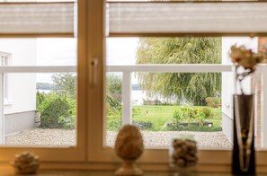 Enjoy a serene view of the lush garden and tranquil pond from the comfort of your room.