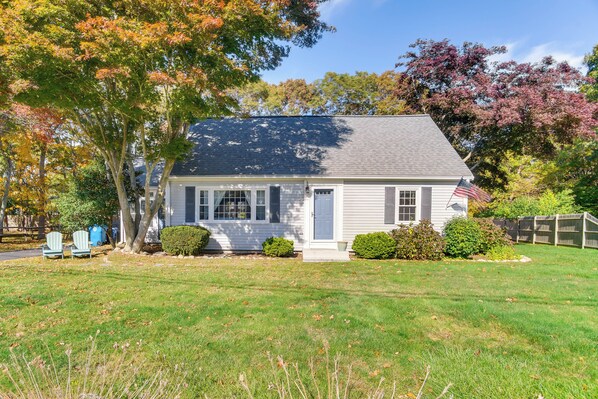 A single-story house with a front porch, a small lawn, and a mailbox. - Bike to Private Beach: Cape Cod Escape w/ Sunroom (East Falmouth)