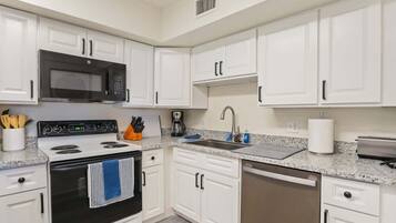 Coffee/tea maker, fridge, microwave, oven