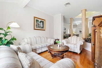 Elegant sitting area with classic decor and soft natural lighting.