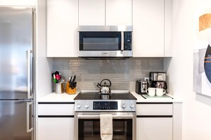 Fridge, microwave, oven, stovetop - Luxury & Bright Apt Downtown Seaport (Boston MA)