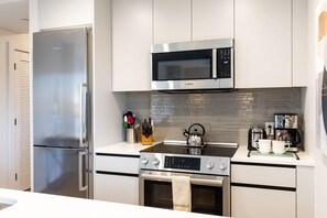 Fridge, microwave, oven, stovetop - Luxury & Bright Apt Downtown Seaport (Boston MA)