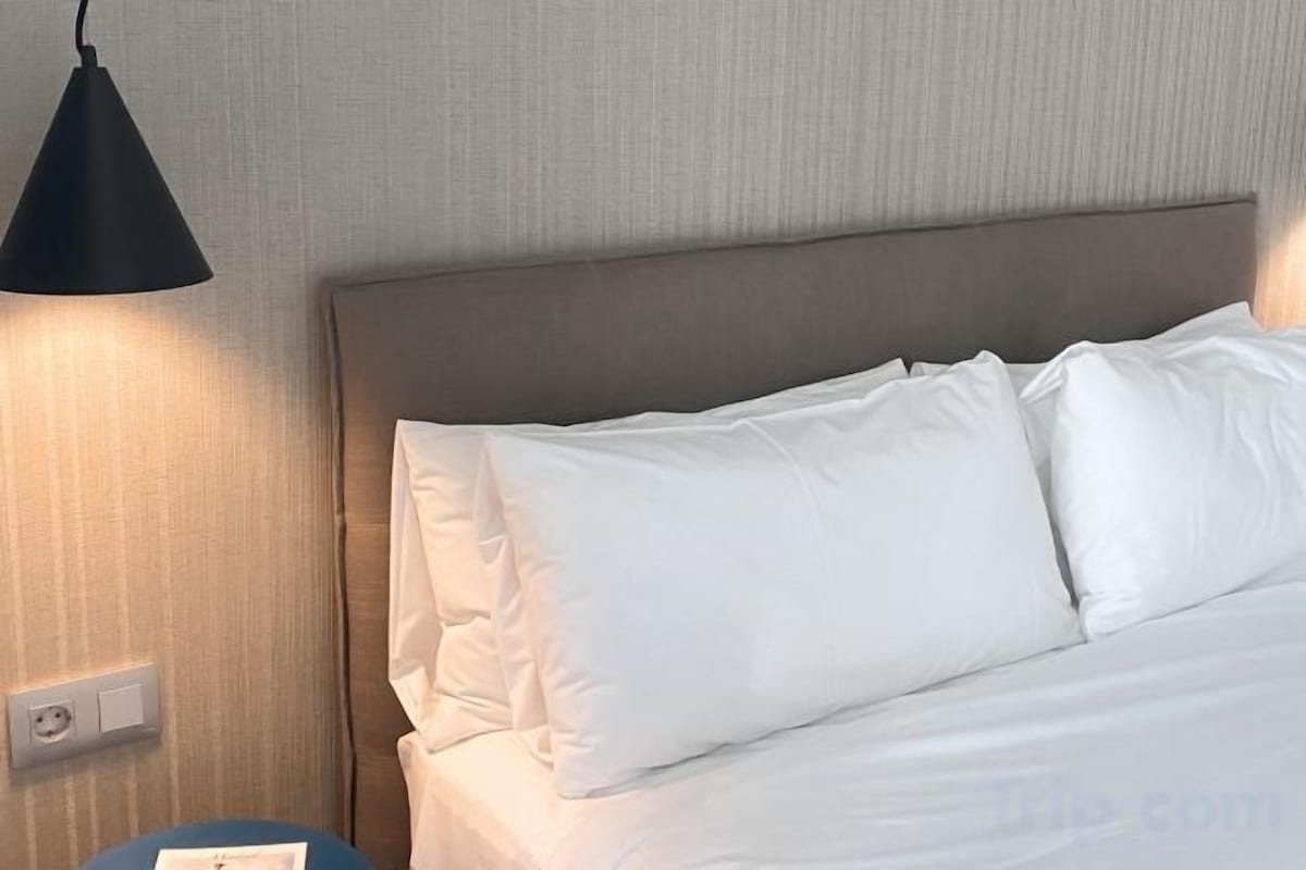 In-room safe, laptop workspace, blackout drapes, soundproofing
