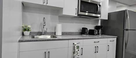 Fridge, microwave, stovetop, coffee/tea maker
