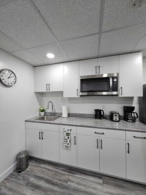 Fridge, microwave, stovetop, coffee/tea maker