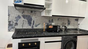 Superior Studio, Pool View | Private kitchen | Full-size fridge, microwave, stovetop, cookware/dishes/utensils