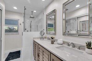 Shower, hair dryer, towels, shampoo