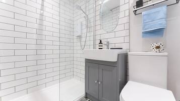 Shower, hair dryer, towels, shampoo