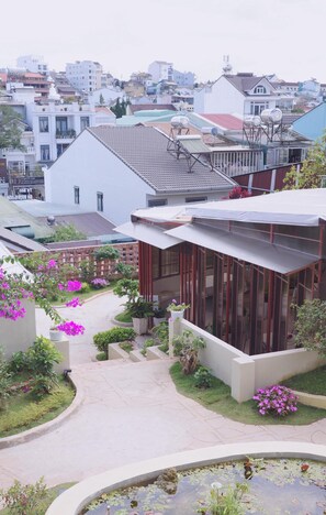 Family Quadruple Room, Garden View | In-room safe, desk, soundproofing, iron/ironing board - Le Macaron Garden Stay - Boutique Hotel Da Lat (Da Lat)