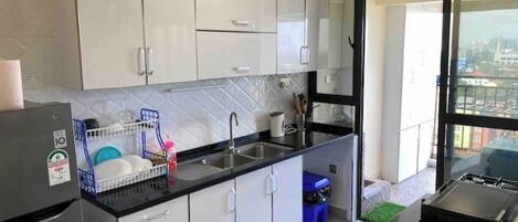 Fridge, microwave, oven, cookware/dishes/utensils