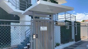 A gated entrance with a sign reading "Main Entrance."