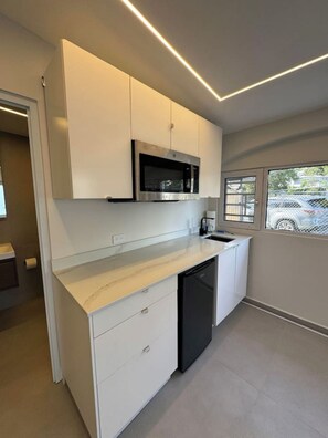 Microwave, stovetop, coffee/tea maker, toaster