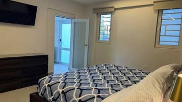 1 bedroom, desk, iron/ironing board, travel crib