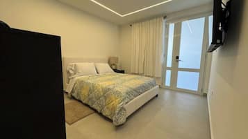 1 bedroom, desk, iron/ironing board, travel crib