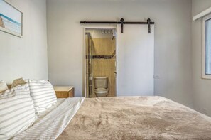 1 bedroom, desk, iron/ironing board, travel crib