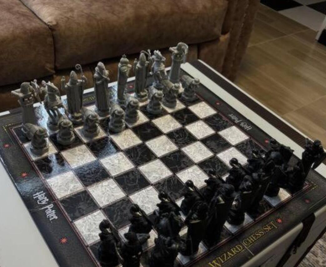 A chessboard with black and white pieces, labeled "Harry Potter."