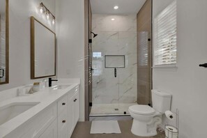 Shower, hair dryer, towels, shampoo