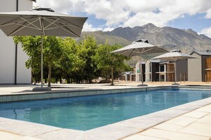 Indoor pool, outdoor pool, open 8:00 AM to 6:00 PM, pool umbrellas