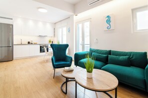Apartamento, 1 habitación, balcón | Zona de estar