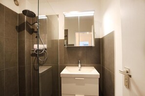 Shower, hair dryer, towels, toilet paper