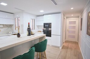 Fridge, oven, cookware/dishes/utensils