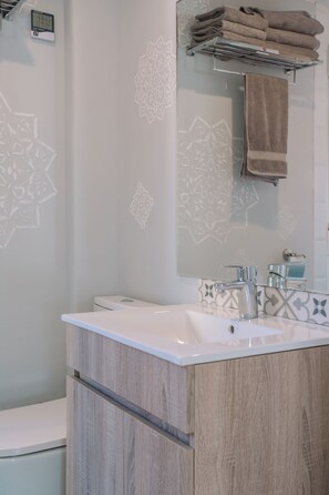 Shower, hair dryer, towels, soap