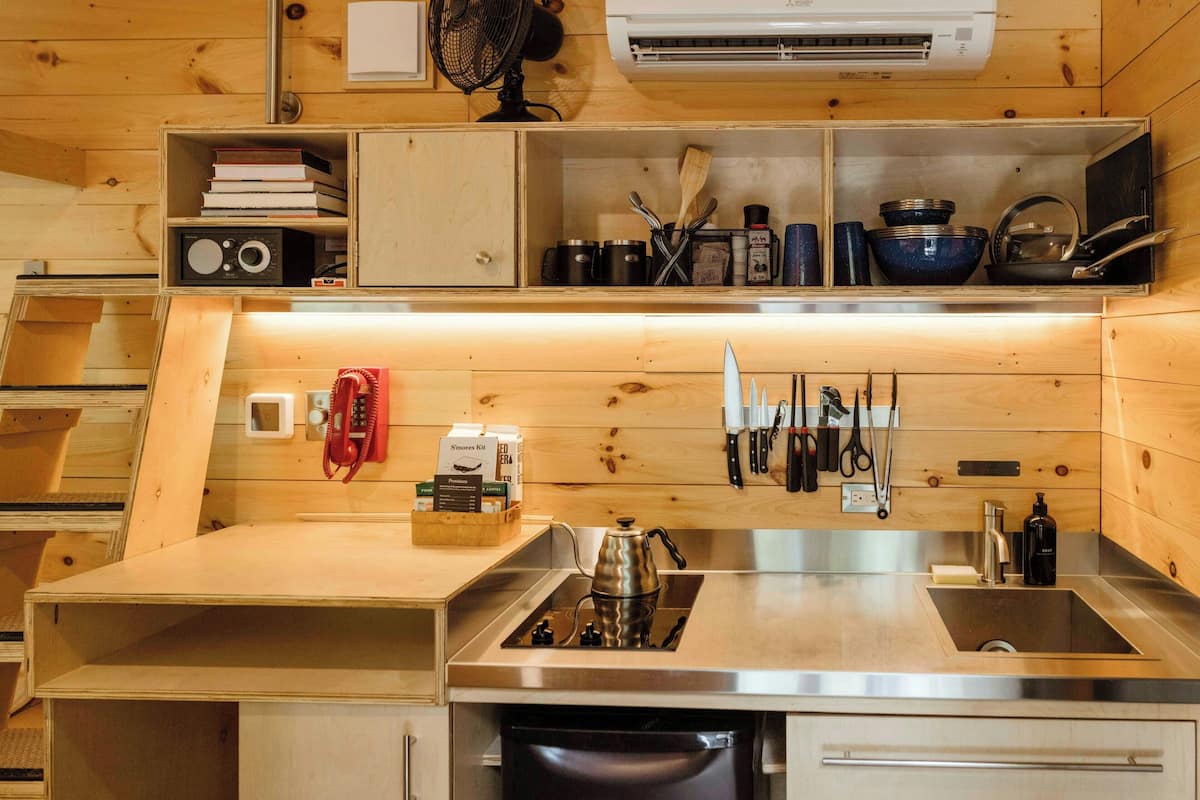 Mini-fridge, stovetop, cookware/dishes/utensils, paper towels