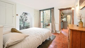 A bedroom with a bed, a large window, and a view of the outside. - Host Stay Hanover Rest (Brighton)