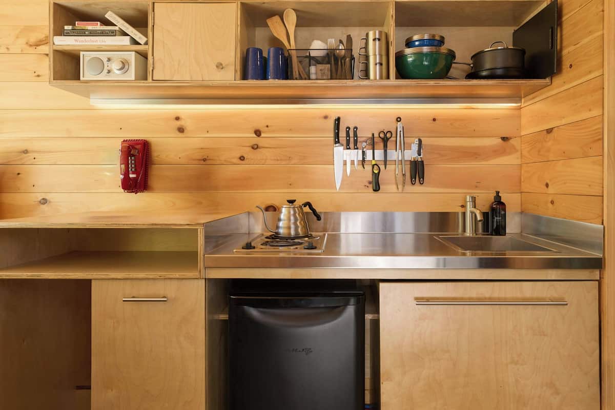Mini-fridge, stovetop, cookware/dishes/utensils, paper towels
