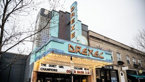 A vintage theater with marquee reading "DREXEC" and listing shows like "The Quiet Girl Champions" and "Cocaine Bear." - #33 Nice stay near Bexley and Capital University (Columbus)