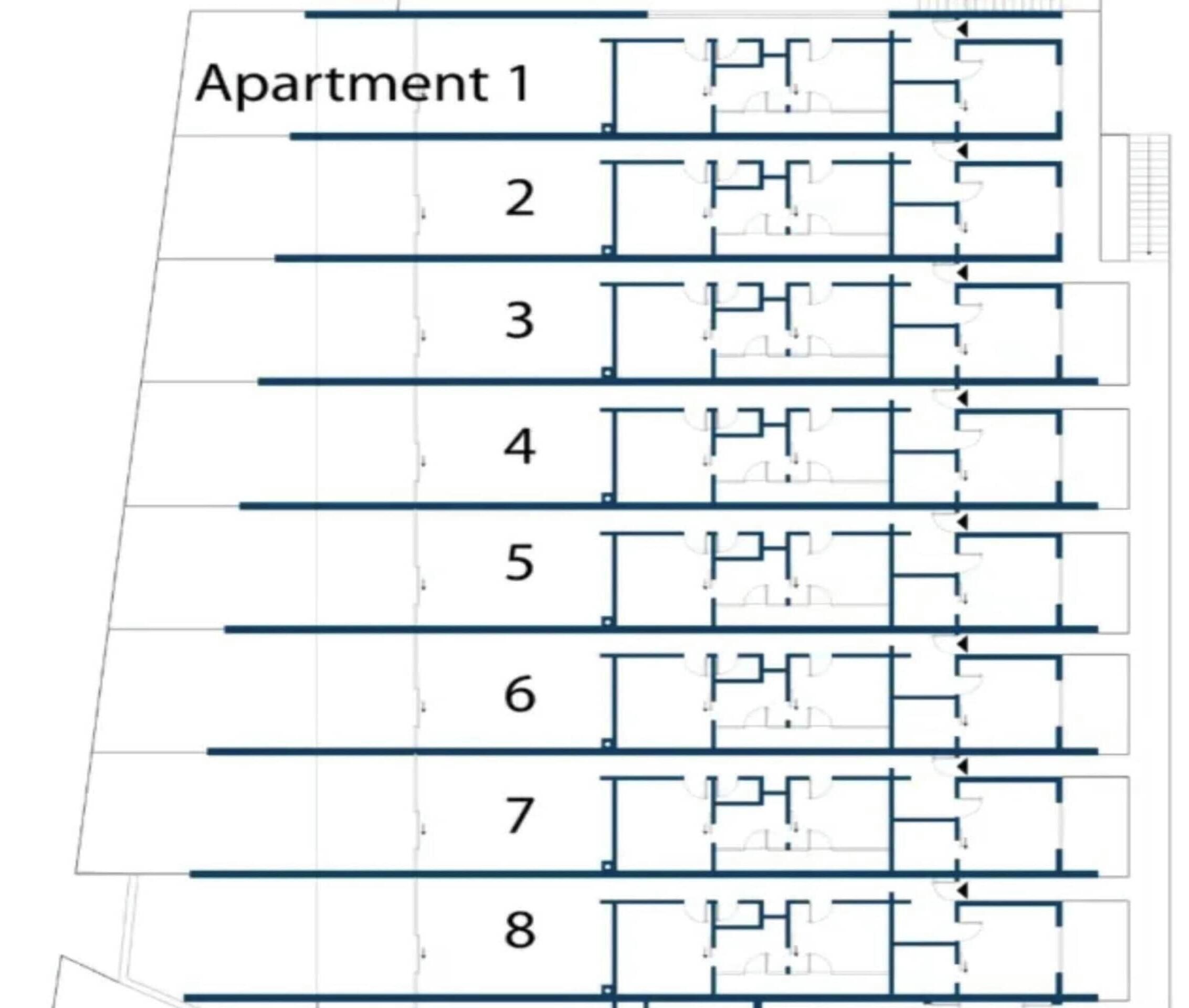 A floor plan of a building with multiple apartments, each with a distinct layout and number.