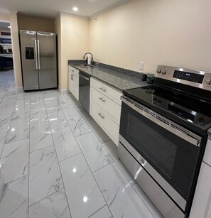 Family Room | Private kitchen | Mini-fridge, microwave, coffee/tea maker, cookware/dishes/utensils - Downtown Camden Hotel (Camden)