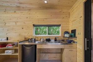 Cabin, 1 Queen Bed | Private kitchen | Mini-fridge, stovetop, cookware/dishes/utensils, paper towels - Postcard Cabins Brown County, Outdoor Collection by Marriott Bonvoy (Columbus)