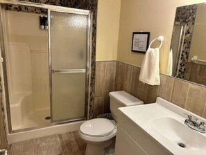 Shower, towels, soap, toilet paper