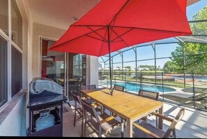 Outdoor dining - Luxury Family Villa with Pool, BBQ & Resort Amenities Near Disney (Kissimmee)